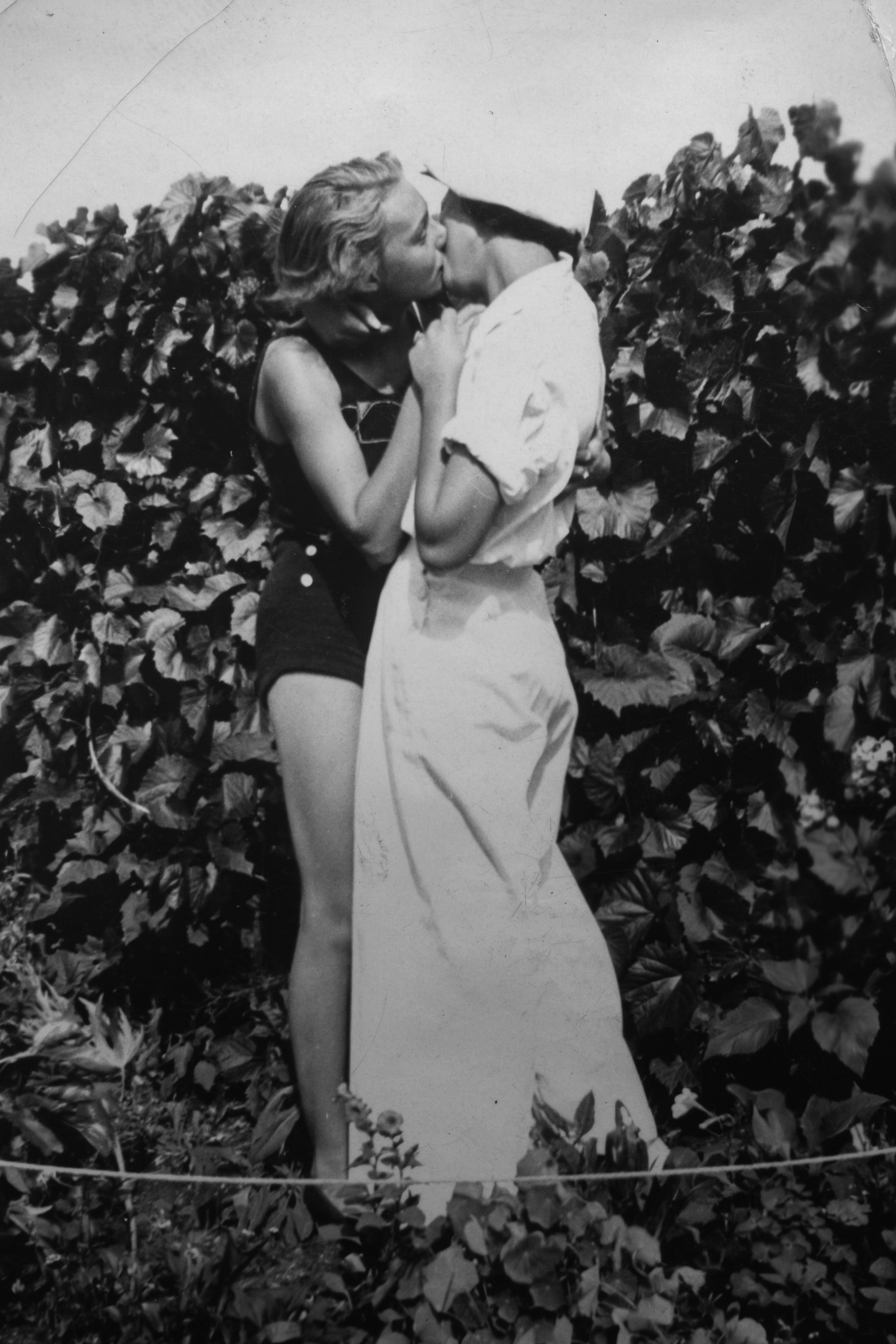 Levi Meir Clancy’s grandmother kissing a woman among grapevines